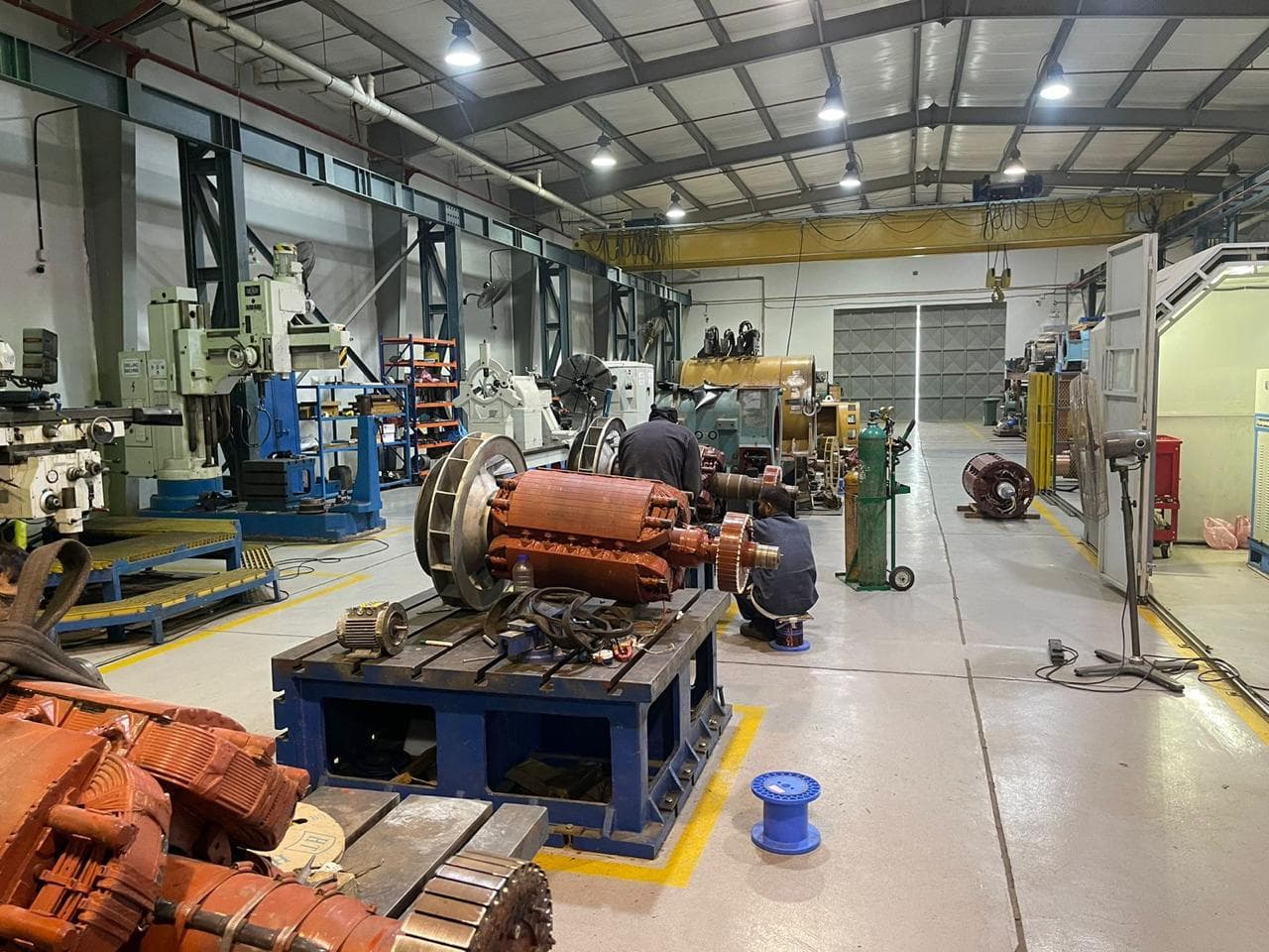 Row of industrial motors under repair
